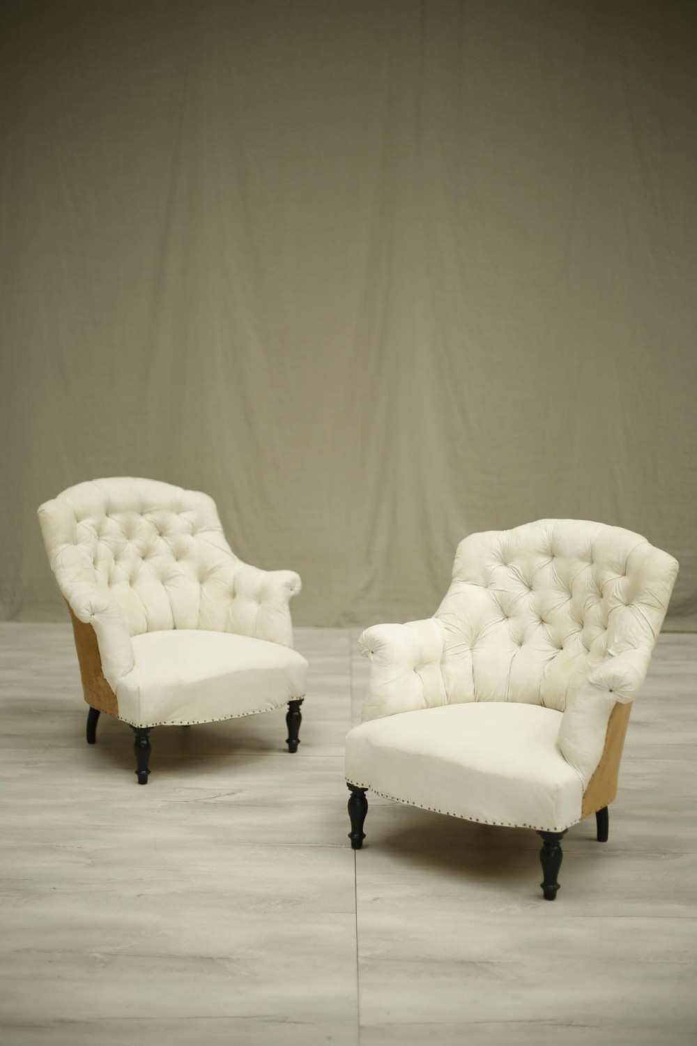 Pair of Napoleon III button shield back armchairs