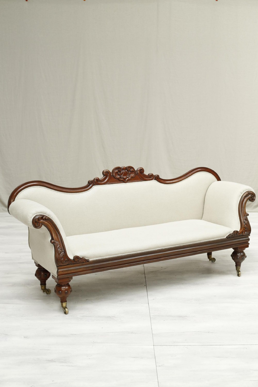 English Regency mahogany sofa upholstered in linen