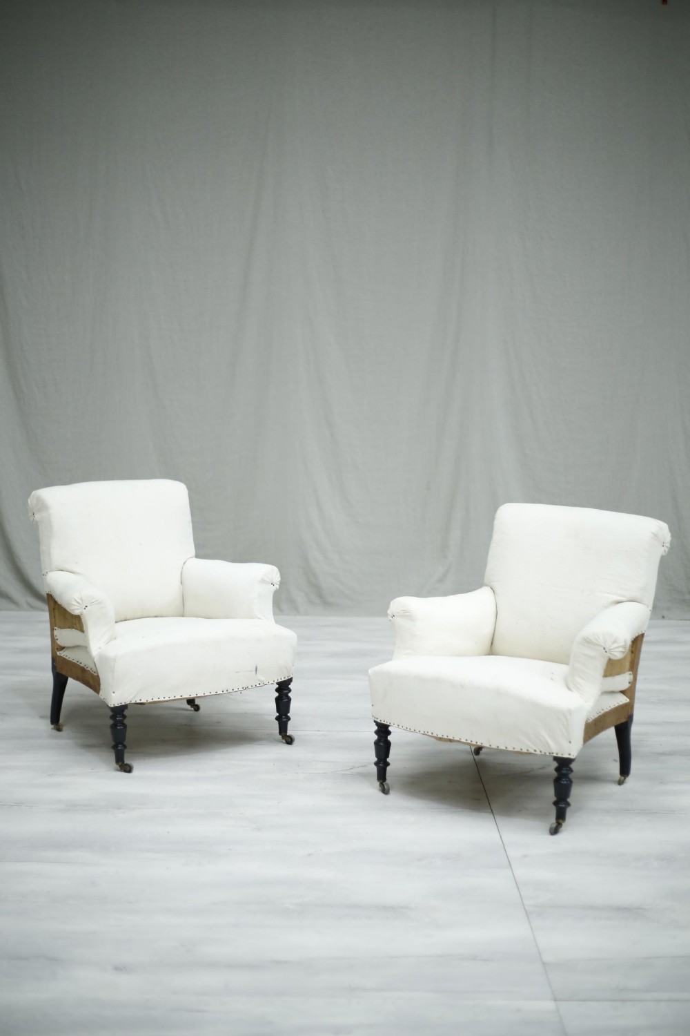 Pair of Napoleon III French scroll back armchairs
