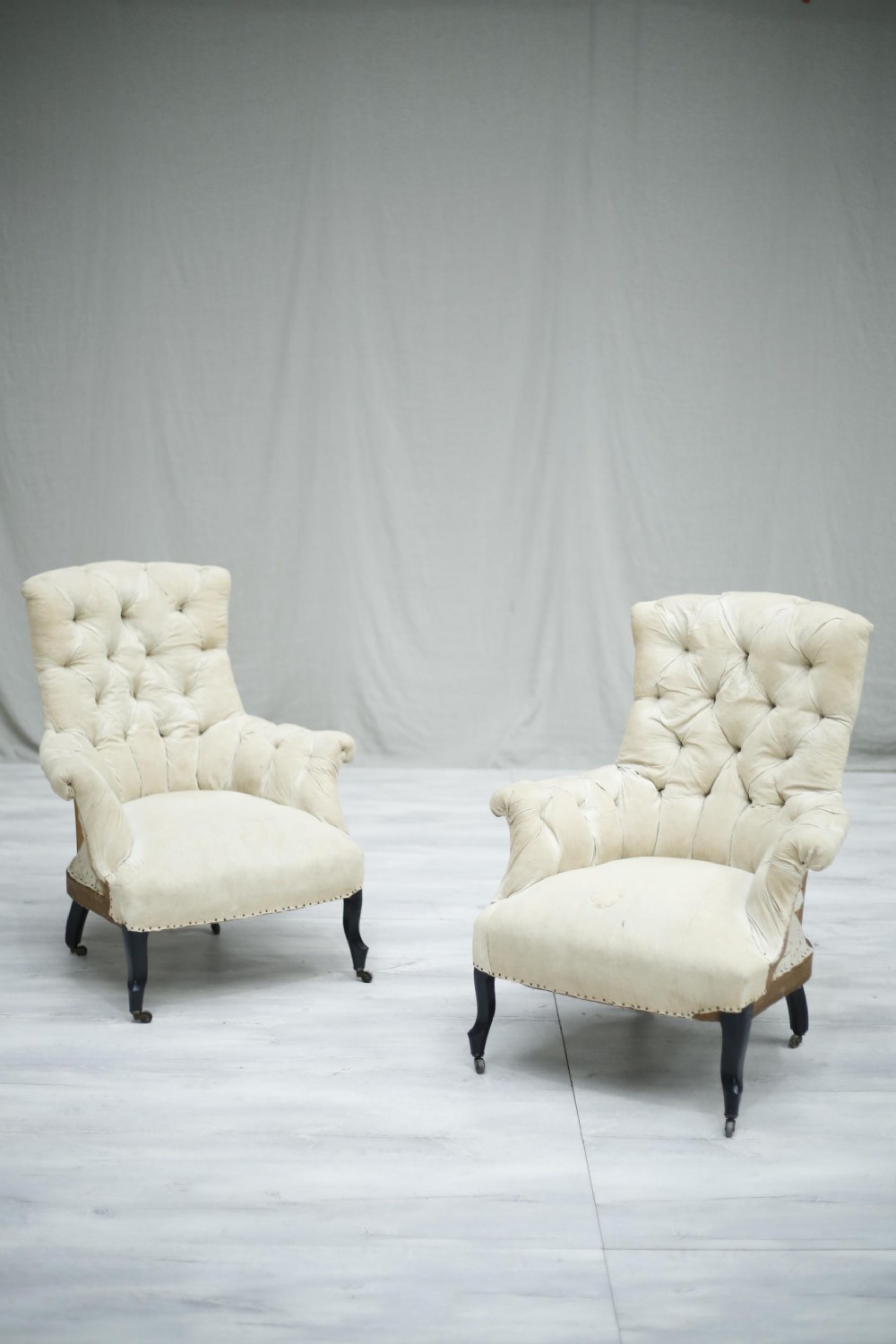 Pair of Napoleon III French high buttoned back armchairs