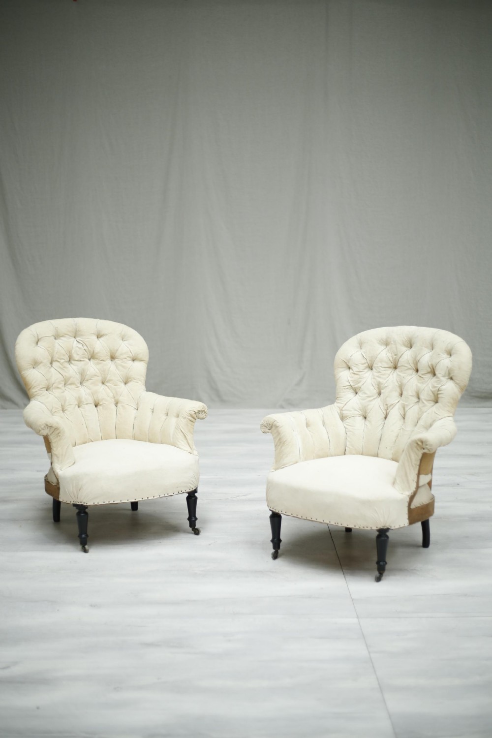 Pair of Napoleon III French buttoned spoon back armchairs