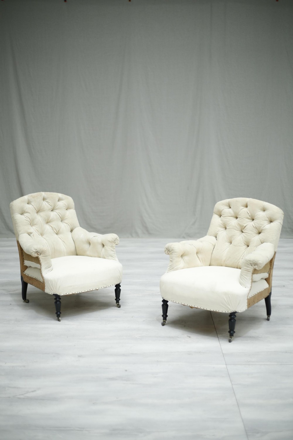 Pair of Antique French Napoleon III curved buttoned back armchairs