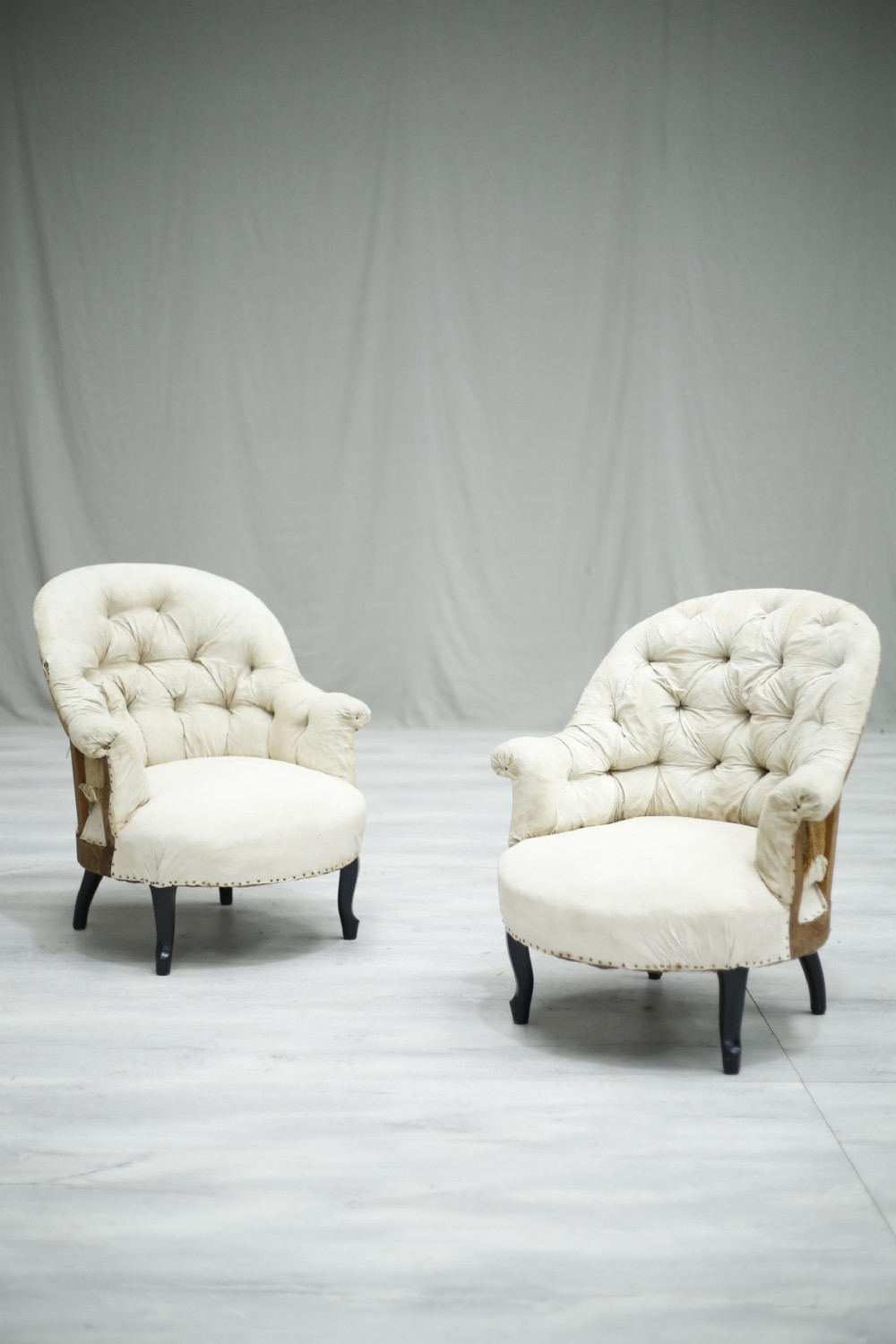 Pair of Antique Napoleon III buttoned back tub chairs