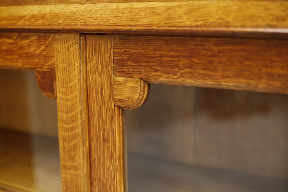 Single c.1920 oak glazed library cabinet View XIII