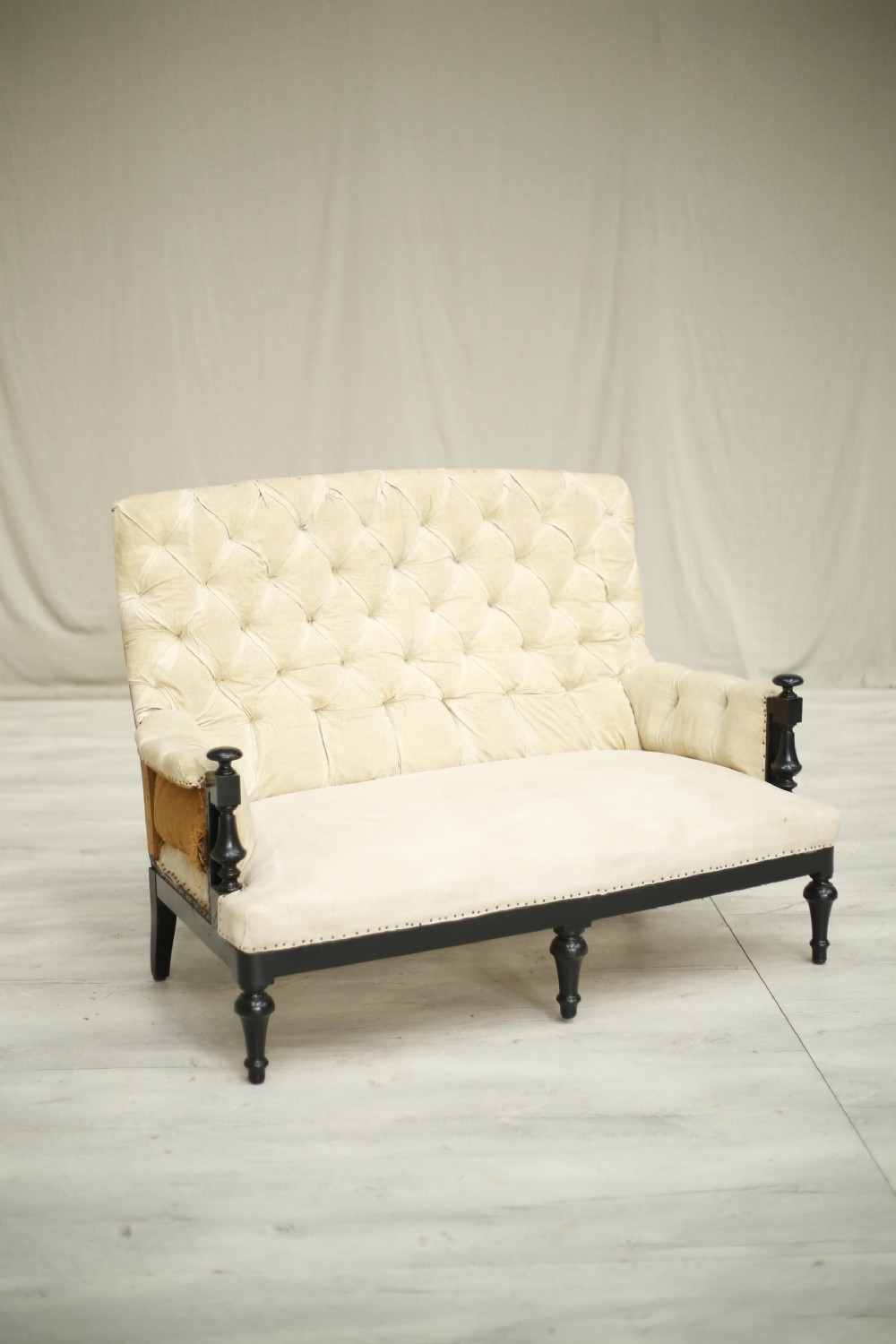 Napoleon III Ebonised frame buttoned back sofa
