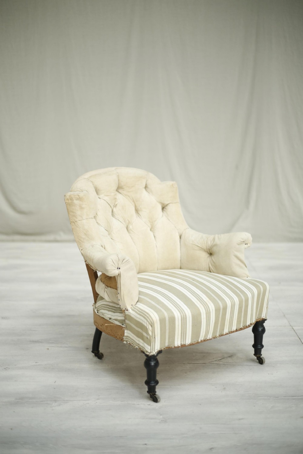 Single Napoleon III buttoned shield back armchair