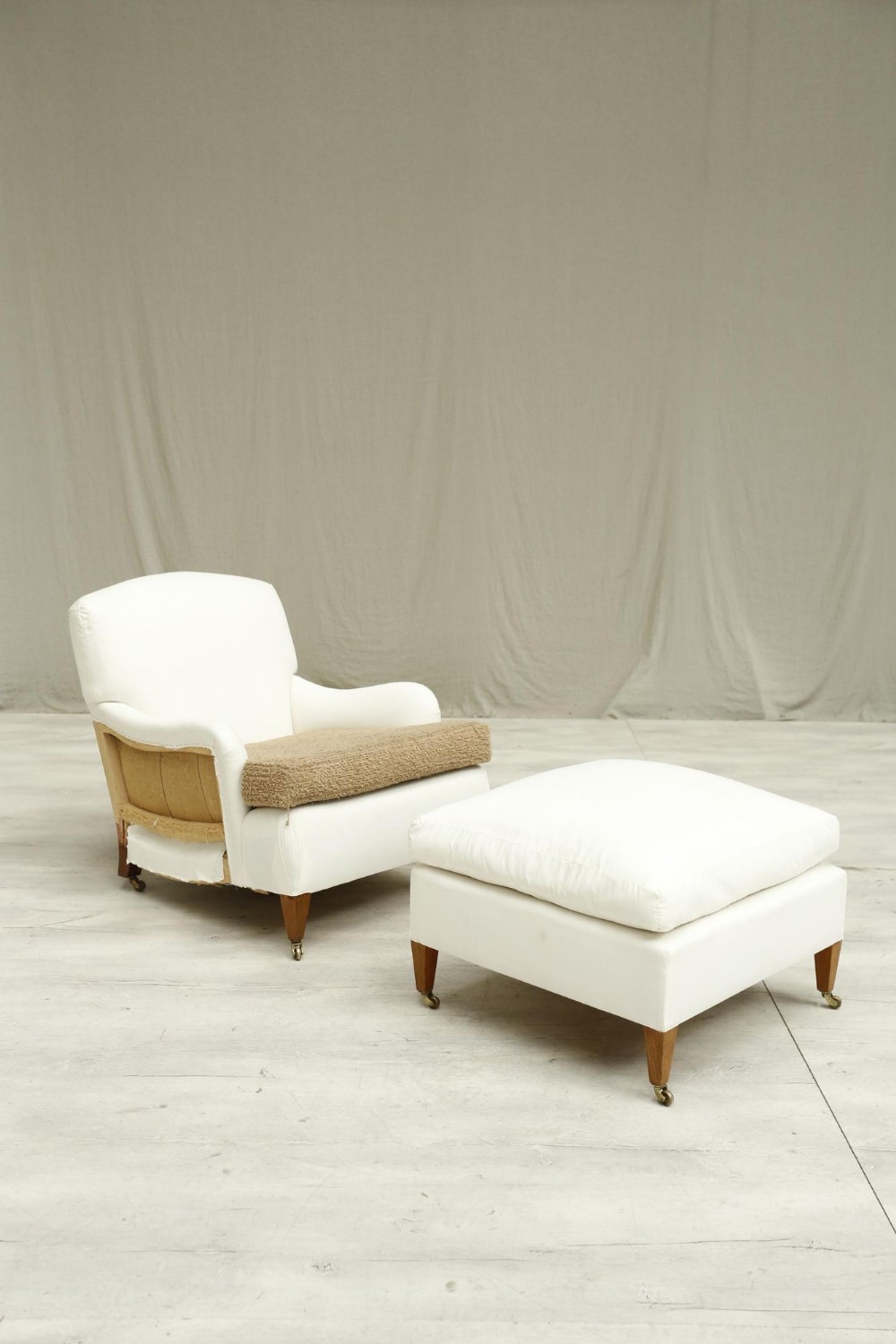 20th Century Howard style armchair and footstool