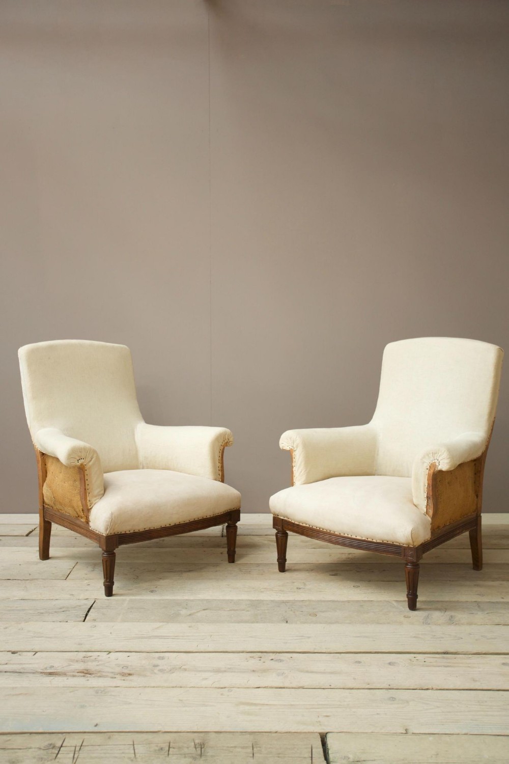 Pair of square back armchairs with carved frame