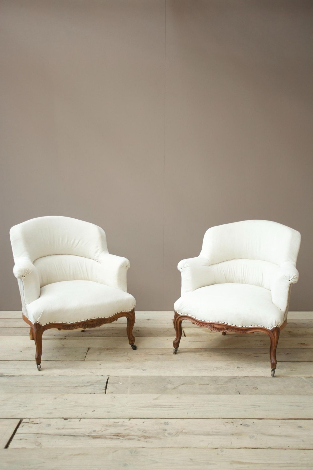 Pair of French shield back armchairs -carved frame