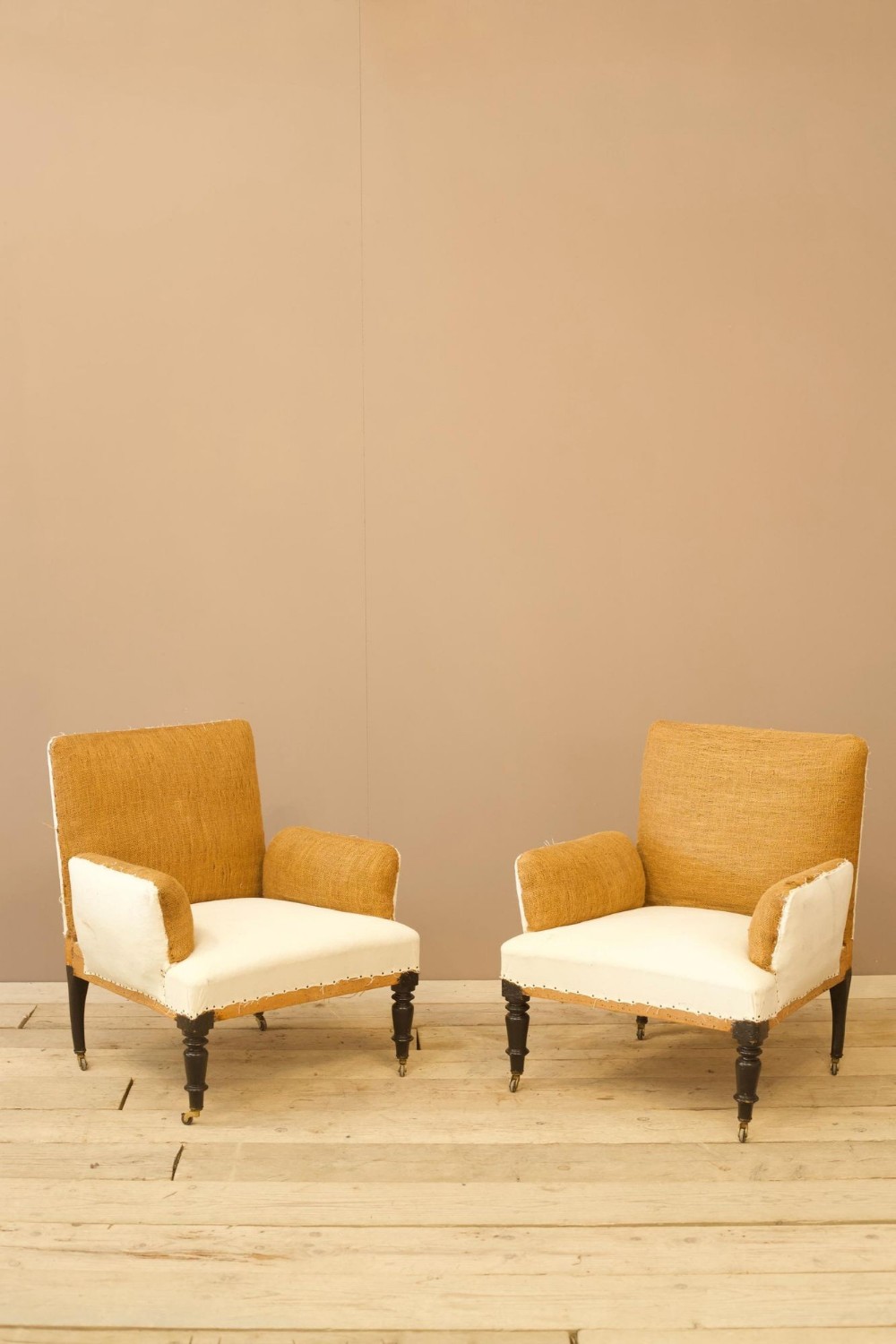 Pair of unusual French cushioned arm armchairs