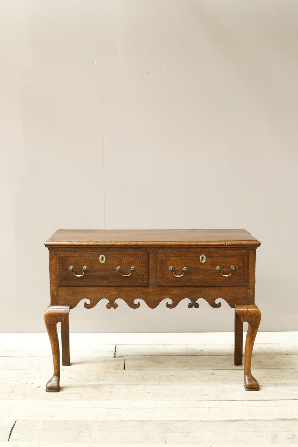 18th century Georgian lowboy with fret work boarder