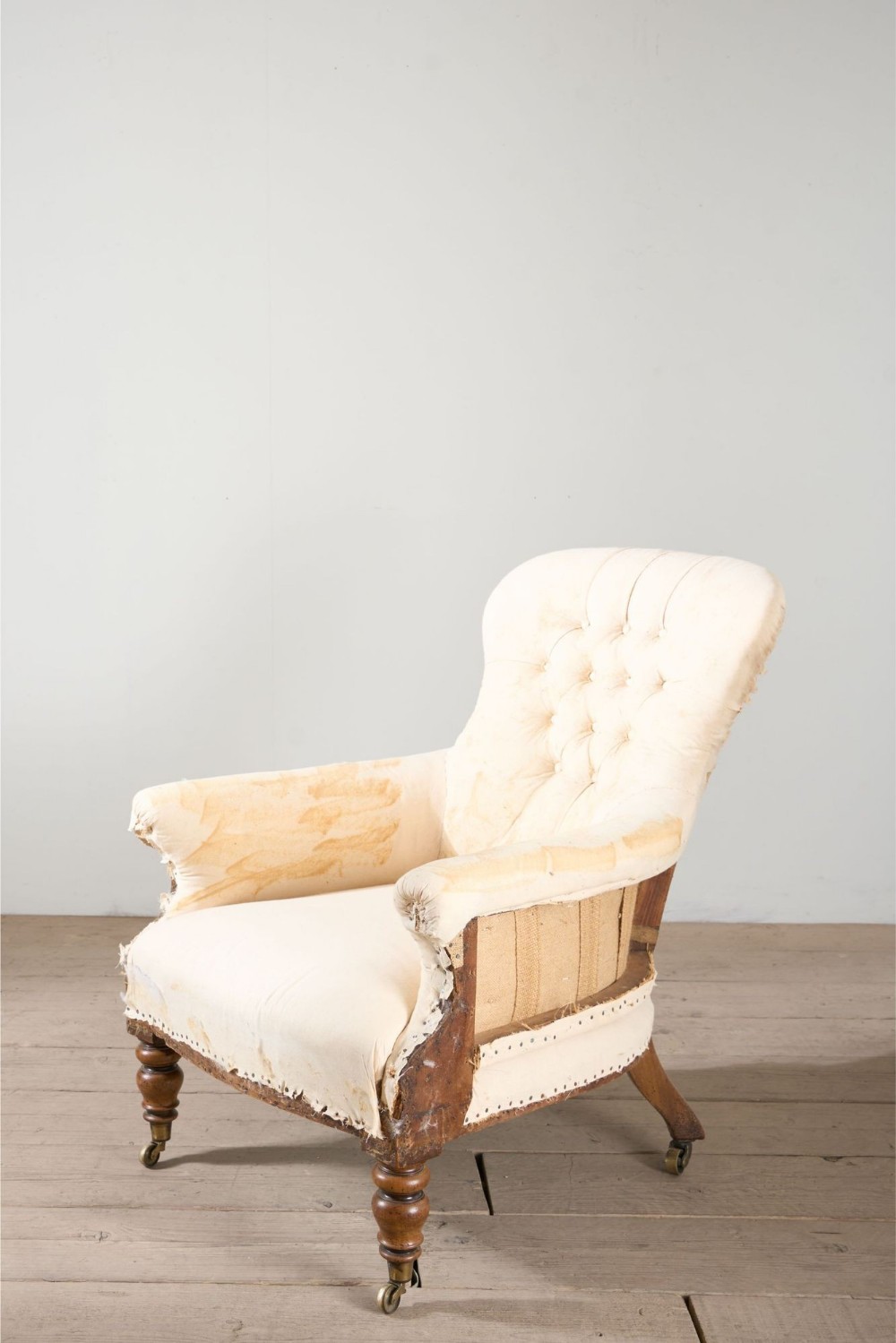 Early Victorian buttoned back country house armchair
