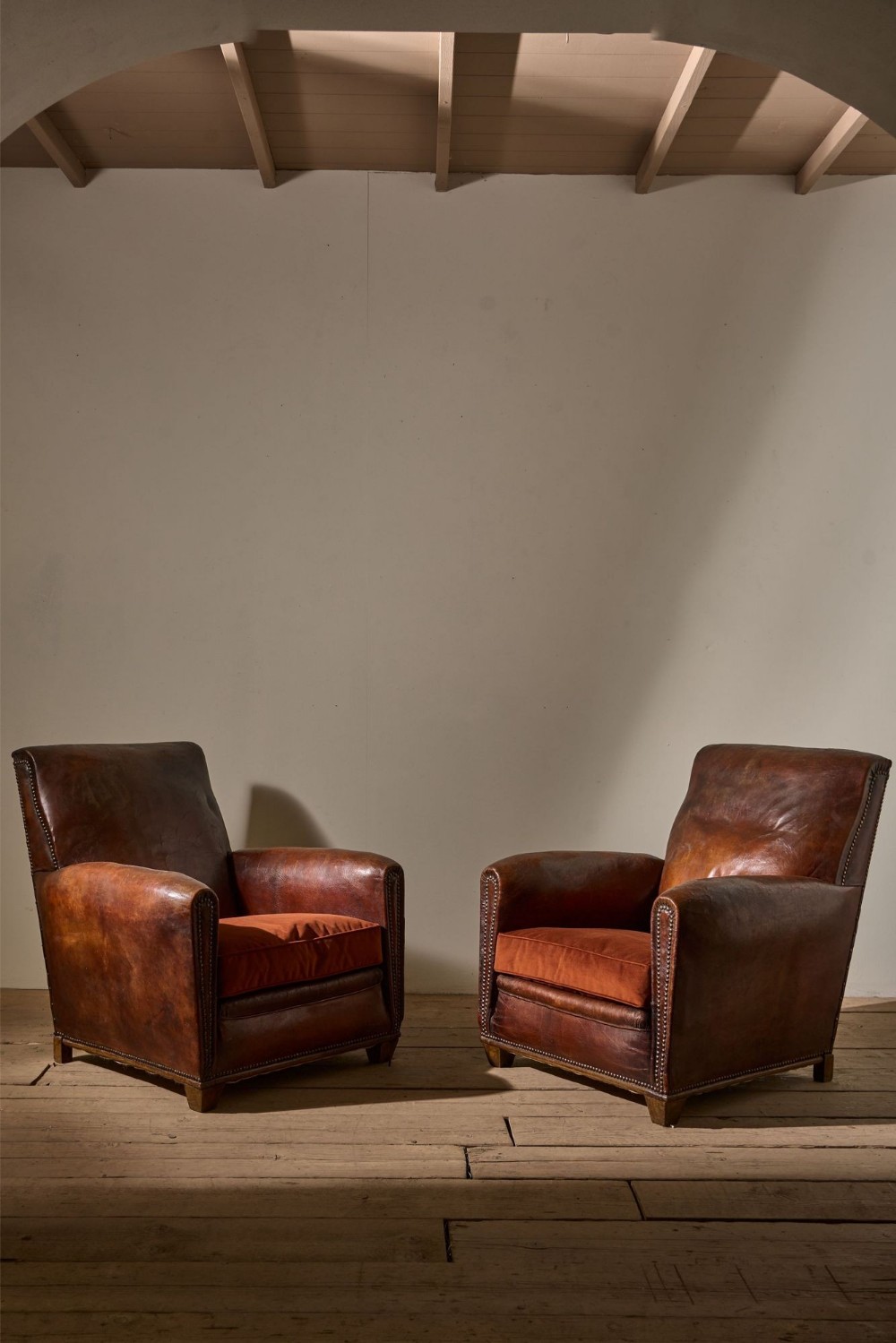 Pair of early 20th century leather club chairs