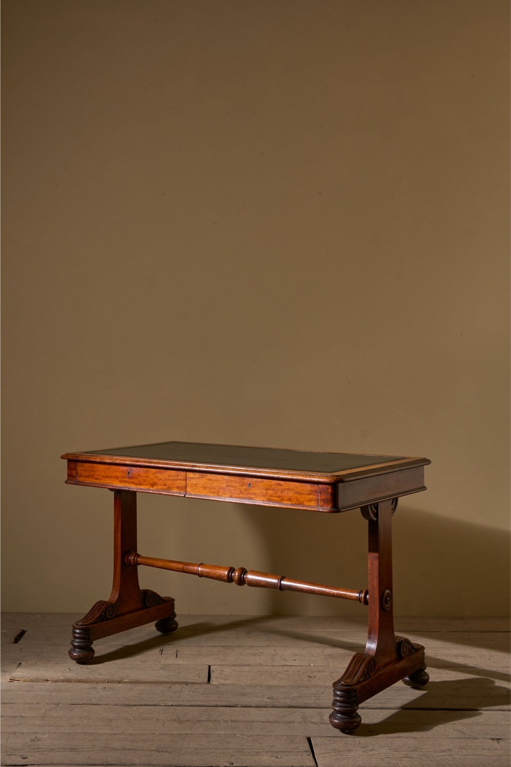 Early Victorian mahogany and black leather writing table by Johnstone & Jeanes