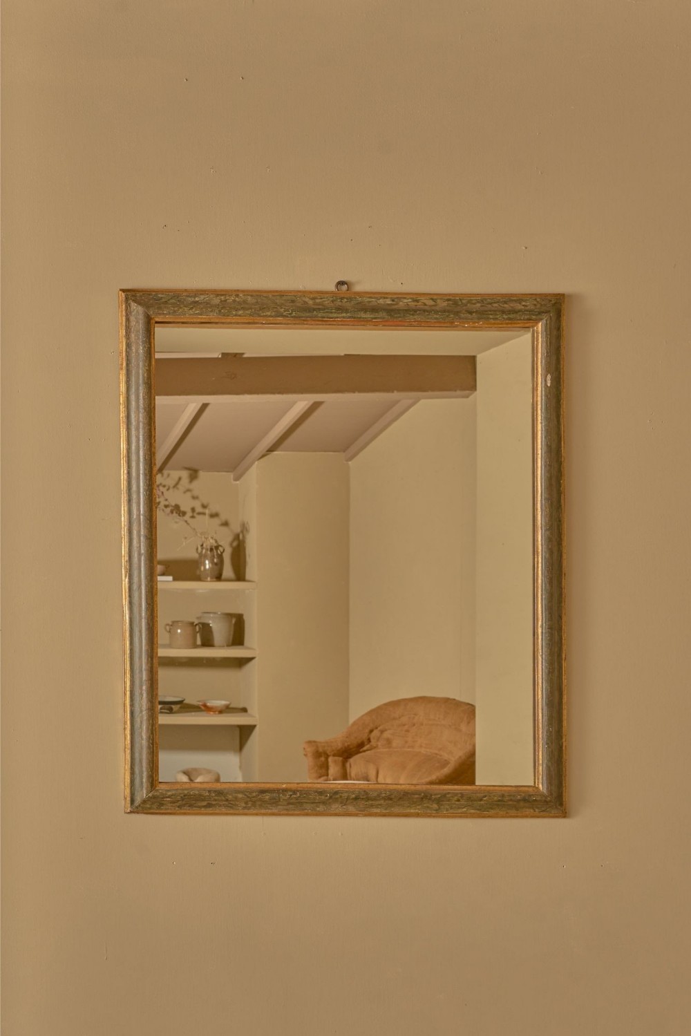 A rectangular 18th-century Italian wall mirror featuring a grey and green hand-painted faux marble timber frame with gilded interior moulding.