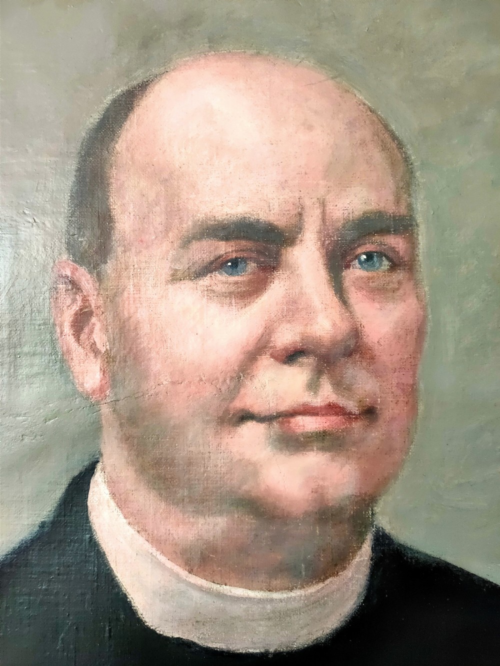 An oil on canvas portrait from the 1920s depicting a clergyman in a black coat and collar inside a gold gilt frame. View III