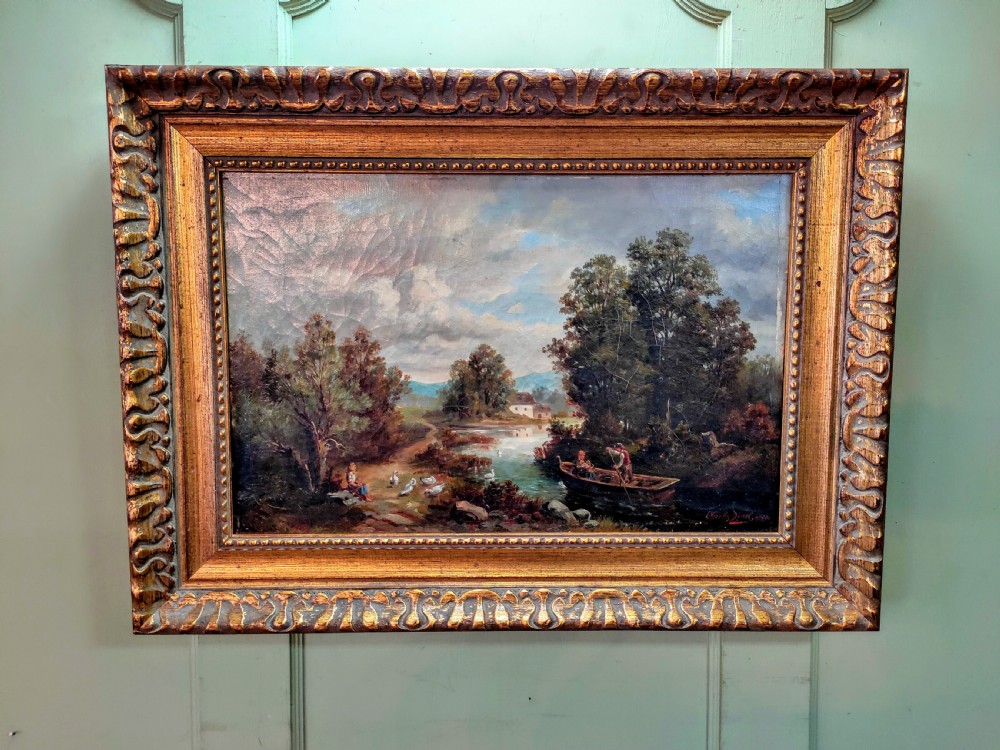 An 1890 Victorian landscape oil painting on canvas depicting figures in a rowboat along a river, housed in a carved gilded frame.