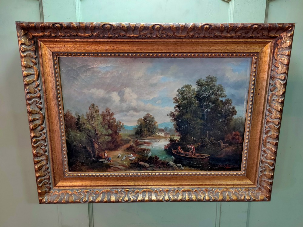 An 1890 Victorian landscape oil painting on canvas depicting figures in a rowboat along a river, housed in a carved gilded frame. View VII