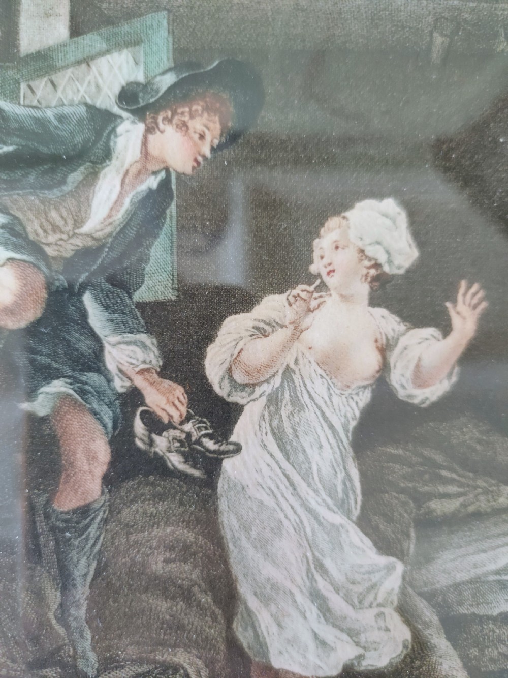 A set of six framed coloured mezzotint engravings depicting eighteenth-century French interior genre scenes, mounted in timber frames. View VII