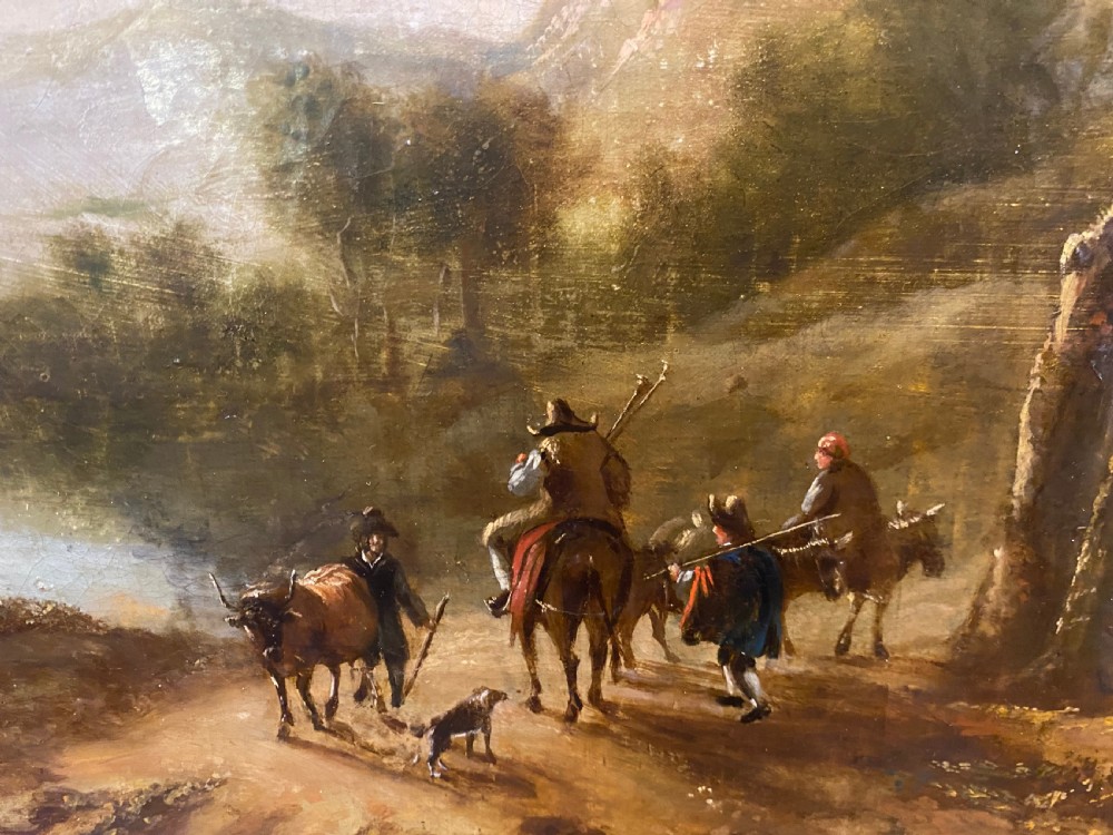 An eighteenth-century Dutch style oil painting on canvas depicting travellers and livestock on a path in a wooded landscape, housed in a golden moulded frame. View III