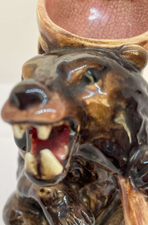 A Victorian earthenware majolica jug moulded in the form of a seated brown bear with an open snarling mouth and a pink-glazed interior. View III