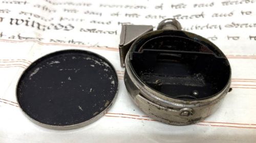A nickel-plated Edwardian Ticka spy camera designed in the form of a pocket watch with a top-mounted viewfinder and engraved casing. View VI