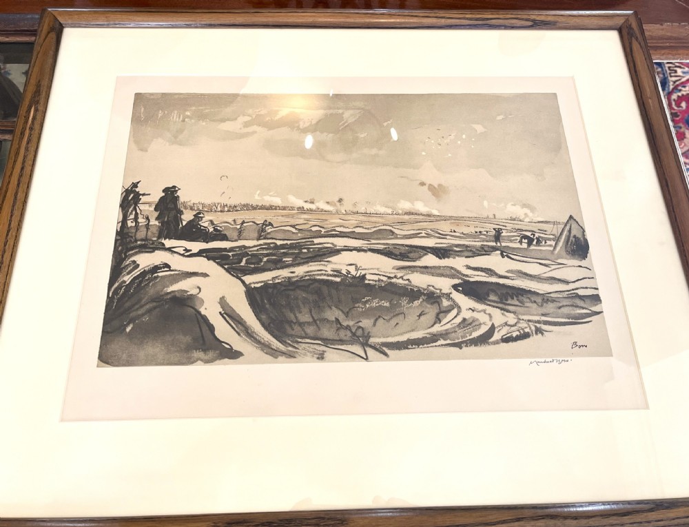A framed monochrome lithograph depicting First World War soldiers observing artillery fire across a landscape with shell craters.