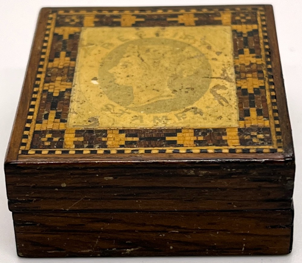 A small square Victorian Tunbridge ware wooden stamp box featuring a geometric inlaid mosaic border and a central profile portrait of Queen Victoria. View III