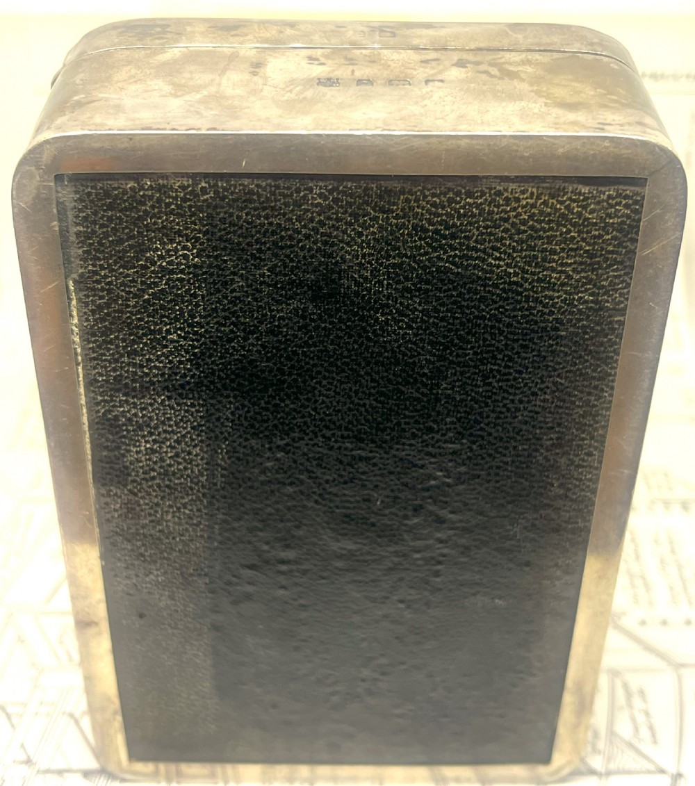 An embossed brass 1914 Princess Mary gift tin mounted inside a silver outer frame. View VII