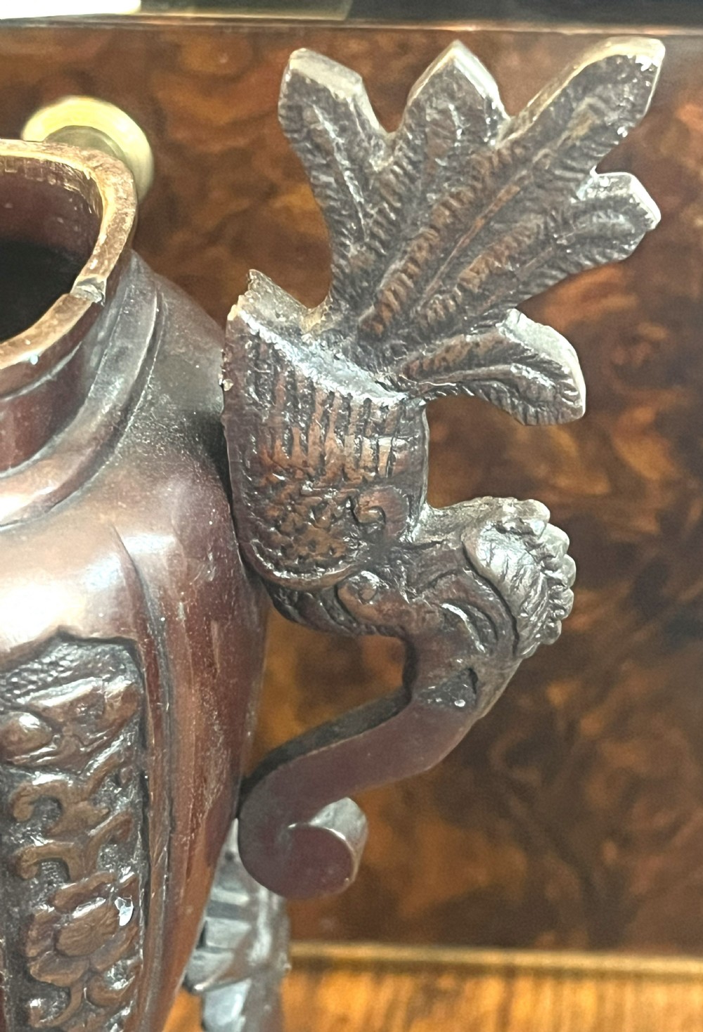 A cast dark bronze Japanese incense burner featuring a shishi guardian dog finial on the lid, floral relief panels, phoenix handles, and beast-head legs. View III