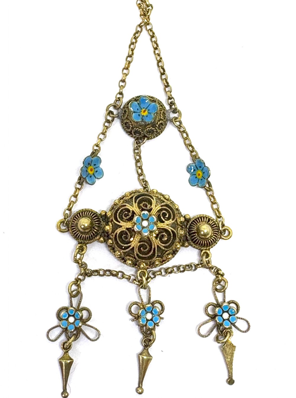 An antique gilded silver filigree pendant necklace featuring light blue enamelled flower motifs and hanging drop accents. View II