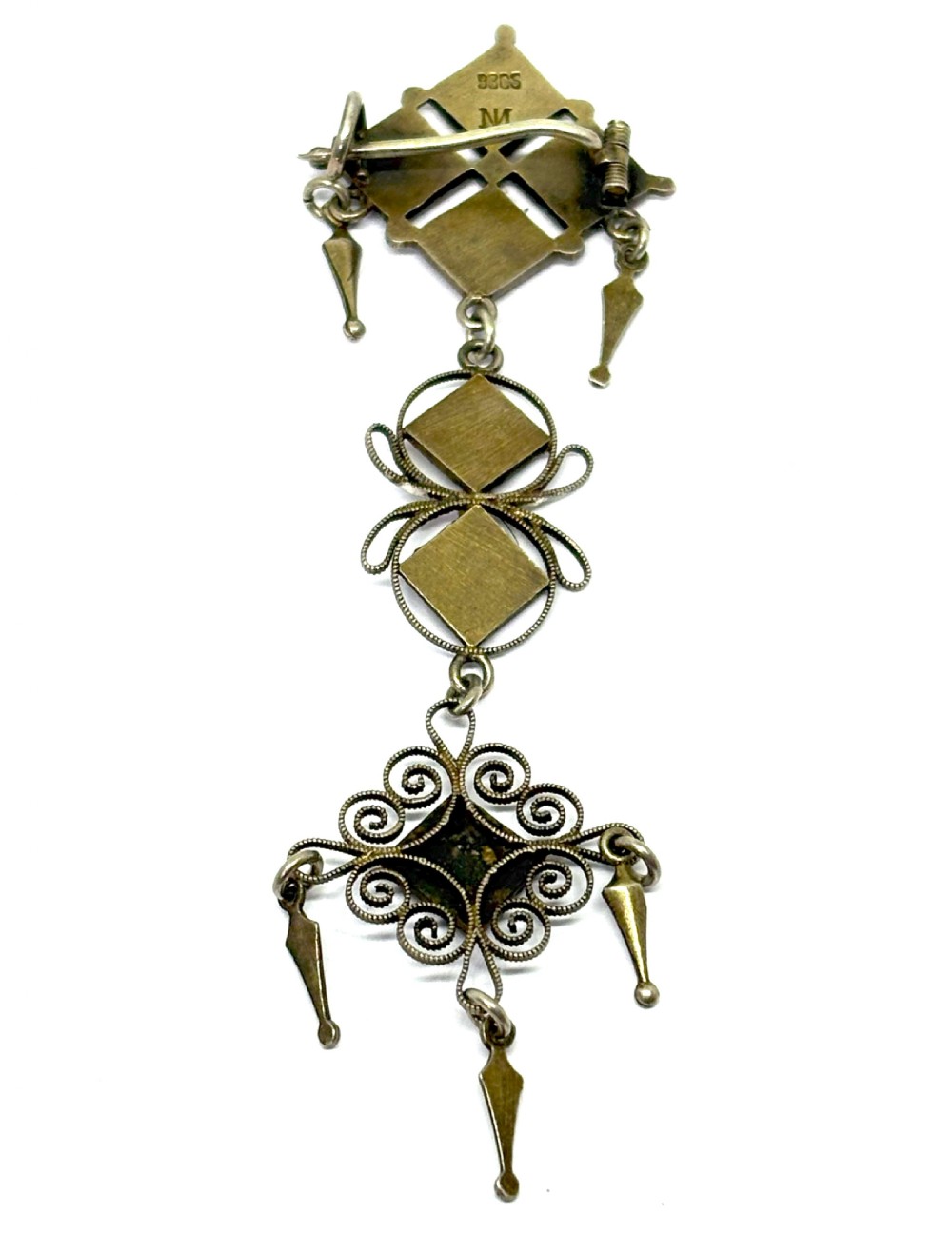 Norwegian silver gilt pendant brooch featuring diamond-shaped red guilloche enamel sections, filigree scrollwork, and suspended conical metal drops. View IV