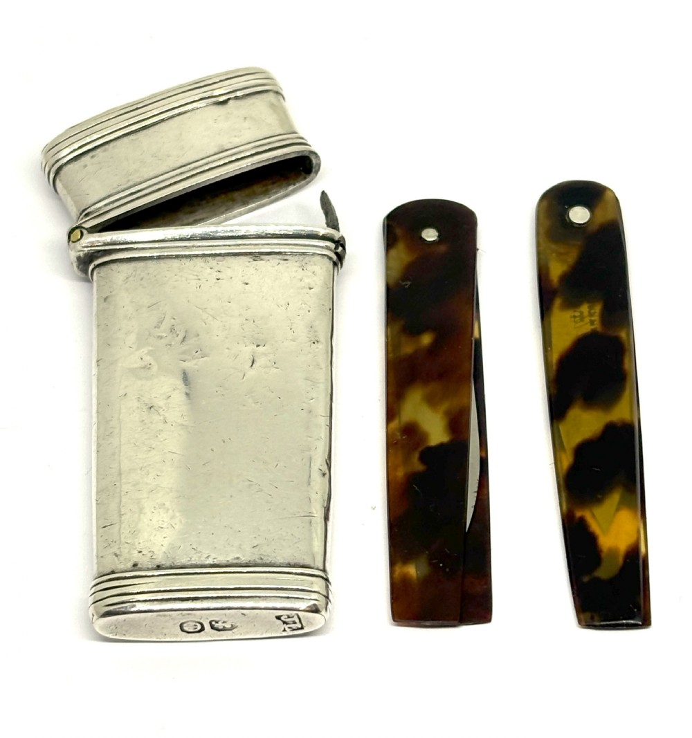 An open Georgian sterling silver case with hallmarked base containing two tortoiseshell-handled instruments. View II