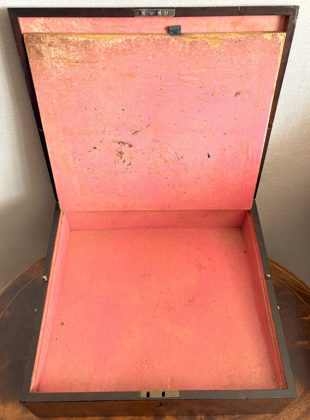 A rectangular burr yew wood box featuring a central oval medallion depicting cherubs with a lion, framed by geometric inlaid borders. View IV