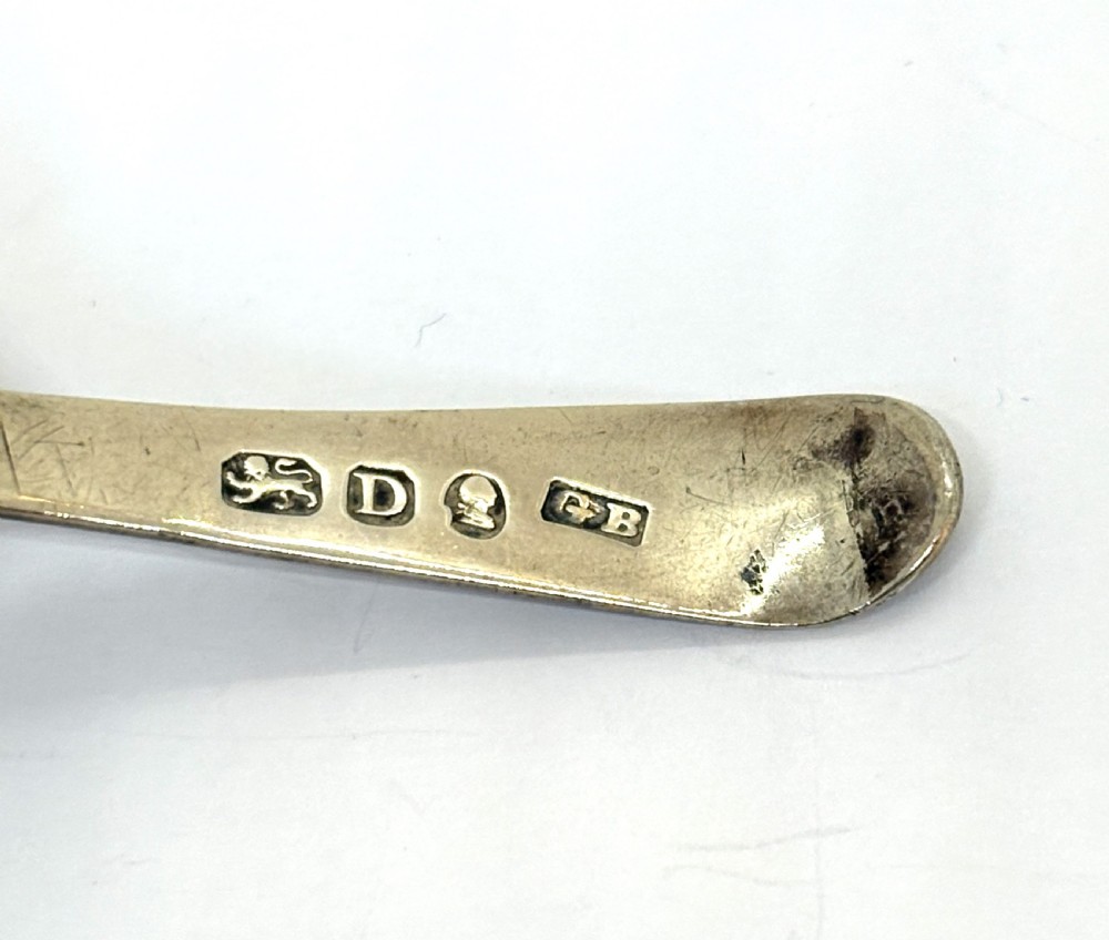A Georgian sterling silver caddy spoon dating from 1799 with a circular pierced floral bowl and bright-cut engraved handle. View III