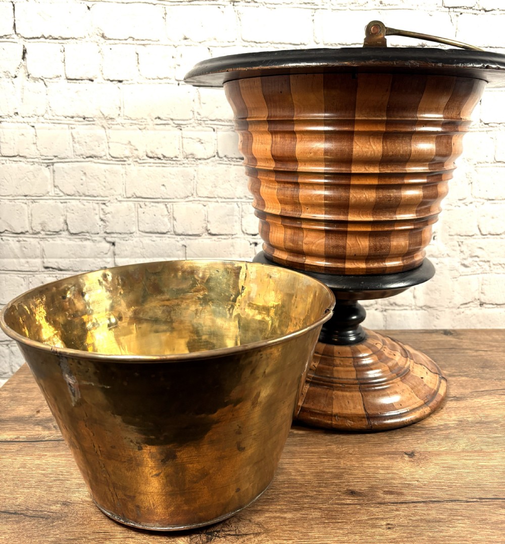 An antique early 19th-century Dutch teestoof featuring staved wood with alternating light and dark stripes, an ebonised rim, pedestal base, and a brass swing handle. View V