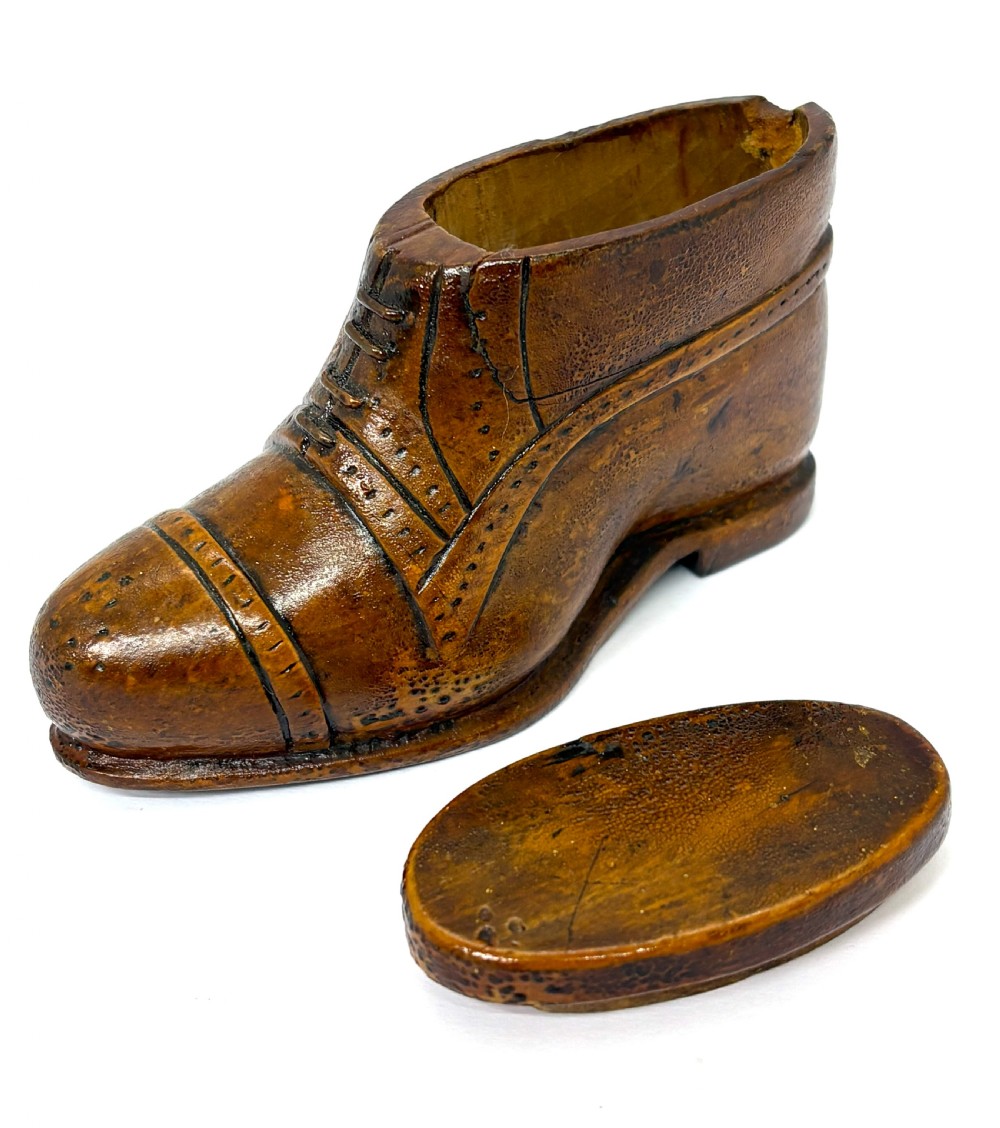 A hand-carved wooden treen snuff box shaped like a shoe with brogue details and a hinged top lid. View III