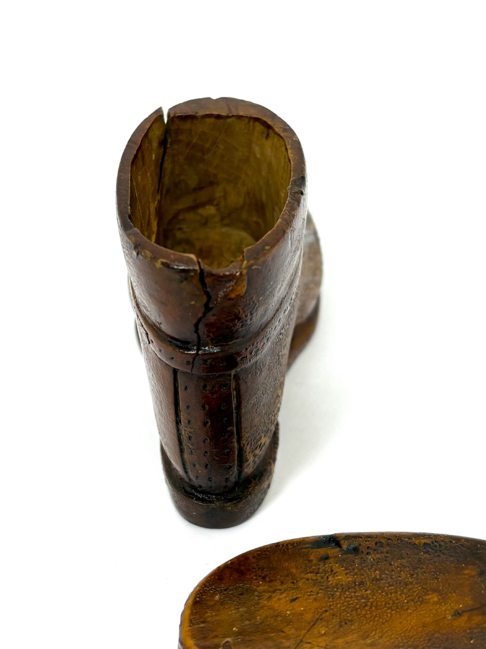 A hand-carved wooden treen snuff box shaped like a shoe with brogue details and a hinged top lid. View IV