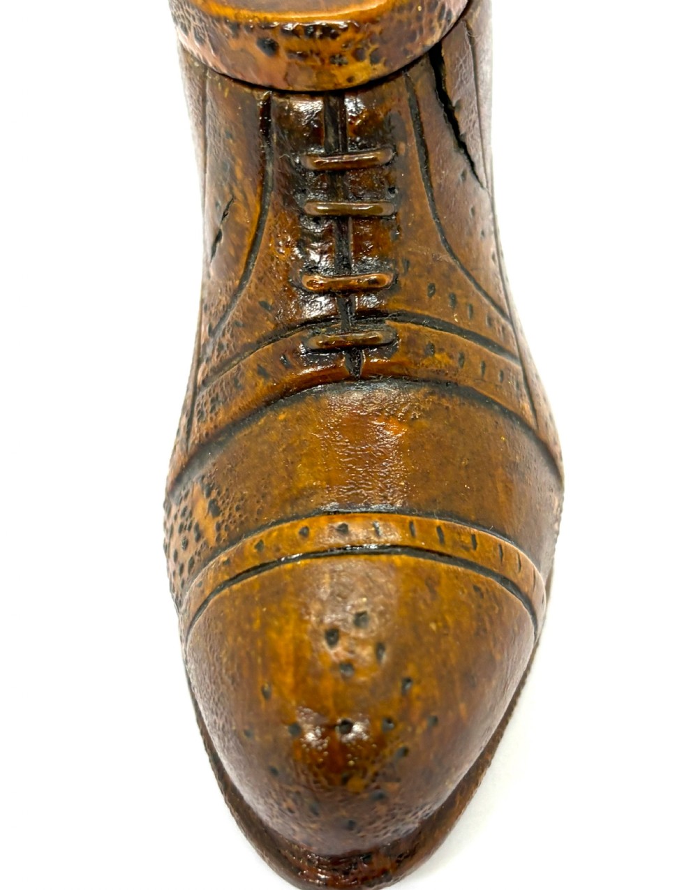 A hand-carved wooden treen snuff box shaped like a shoe with brogue details and a hinged top lid. View V