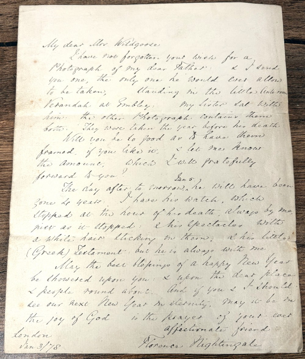 A single sheet of cream paper with dark cursive handwriting signed by Florence Nightingale at the bottom.