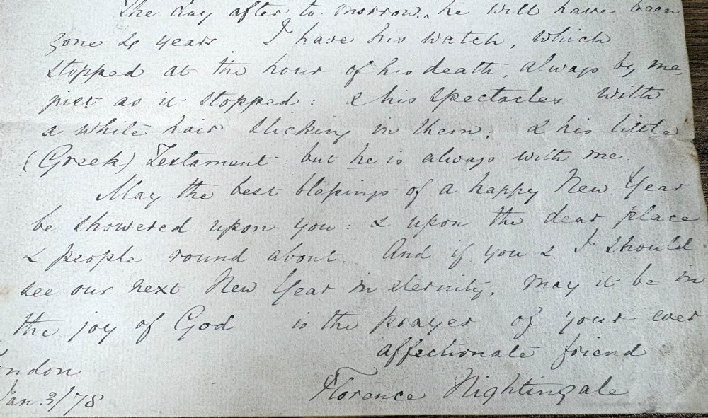 A single sheet of cream paper with dark cursive handwriting signed by Florence Nightingale at the bottom. View IV