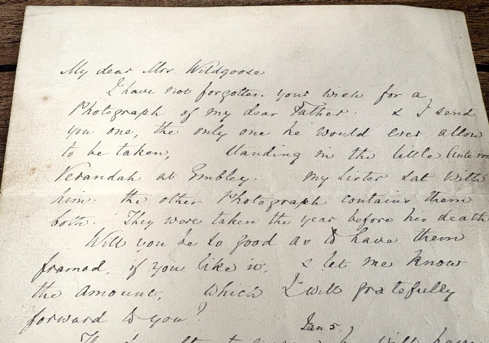 A single sheet of cream paper with dark cursive handwriting signed by Florence Nightingale at the bottom. View VI