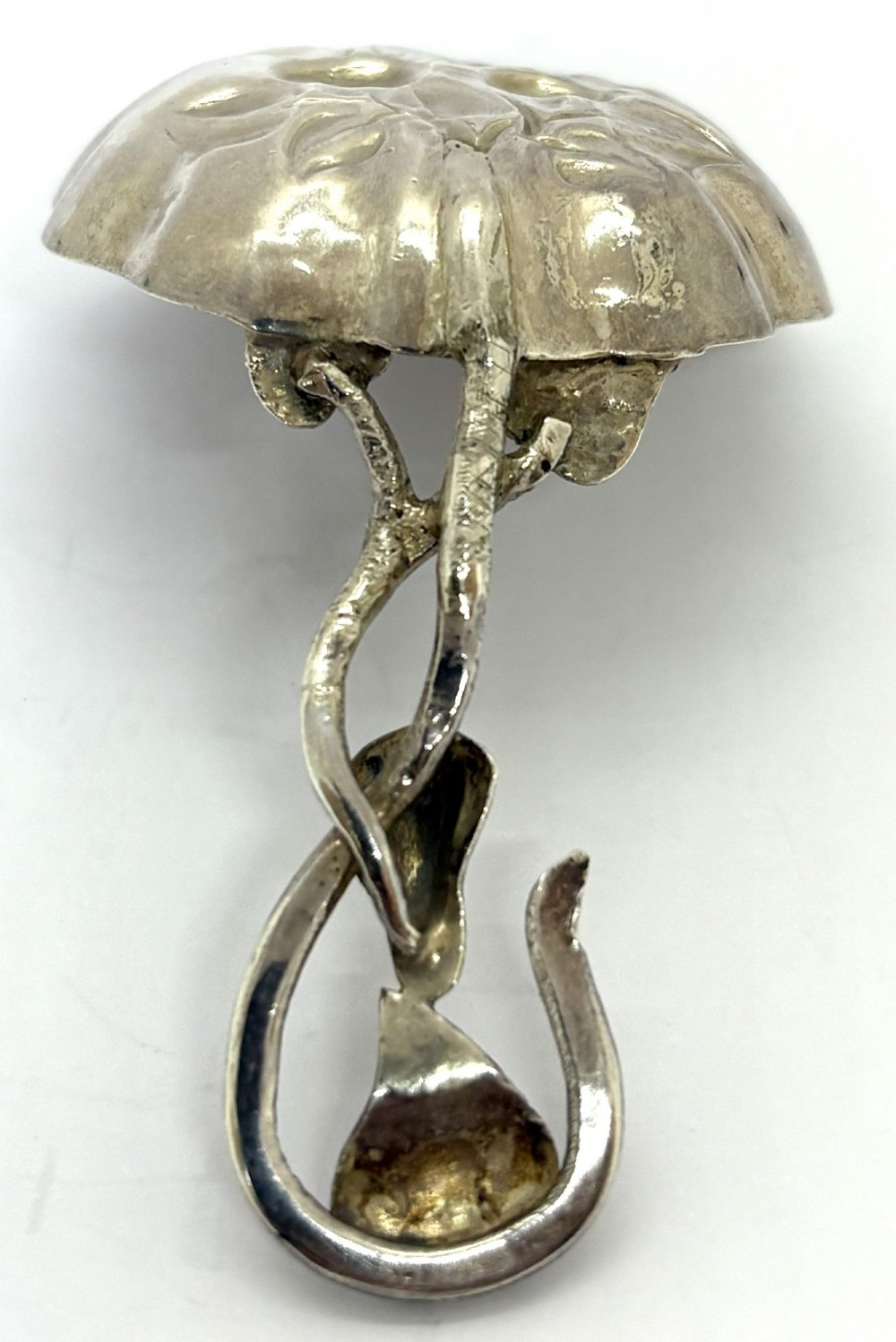 A Victorian silver caddy spoon featuring a scalloped bowl embossed with fruit and leaves alongside a branch-form handle. View IV