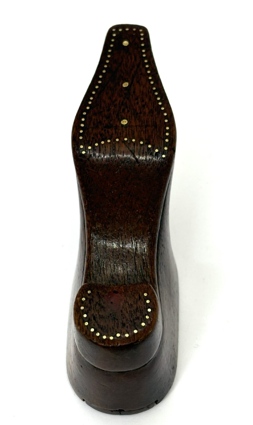 A carved dark wood Georgian snuff box shaped like a shoe with brass pinwork inlay and a sliding top lid. View IV
