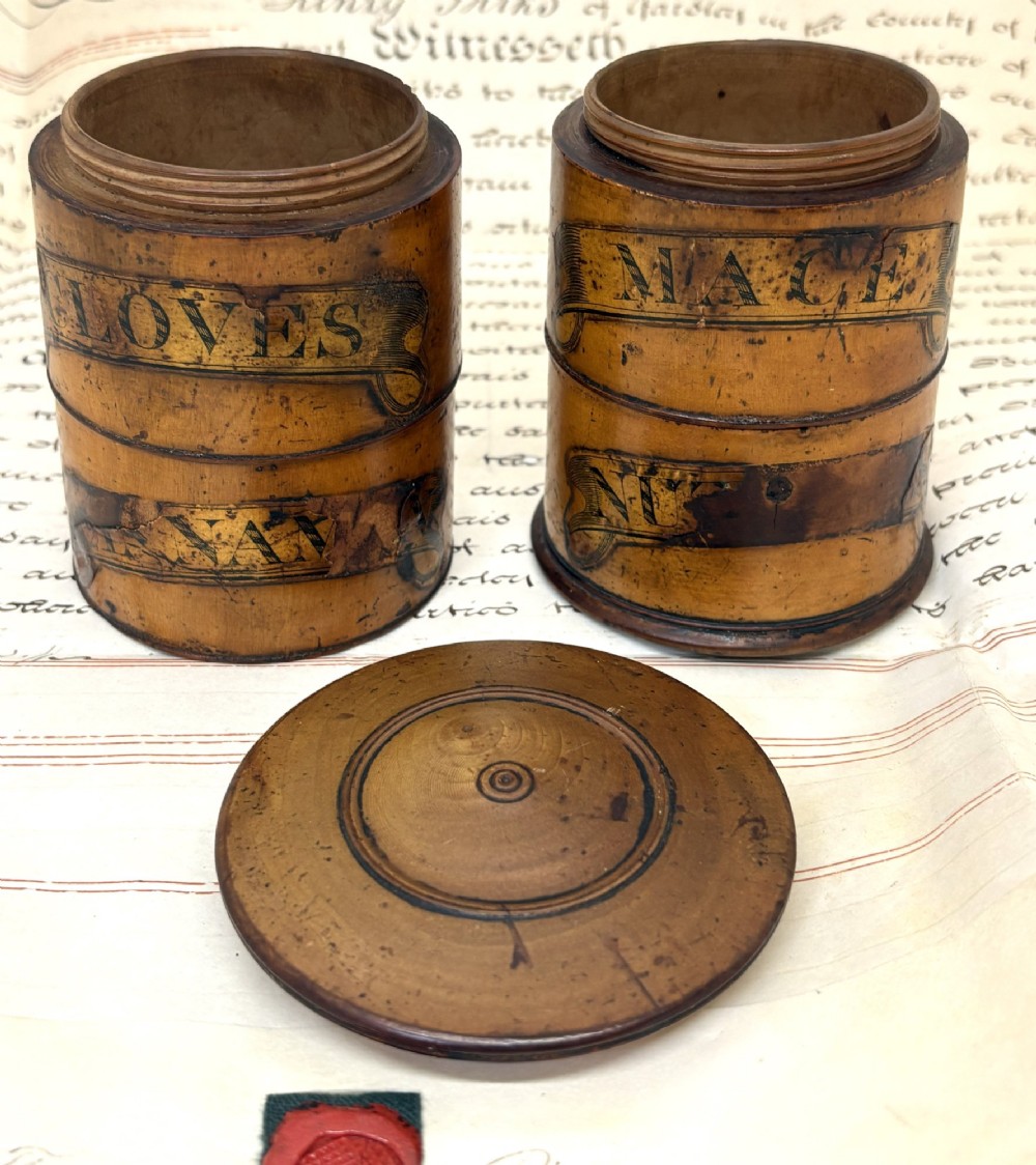 A cylindrical Georgian turned wood spice tower featuring stacked compartments with printed black lettering including Cloves and Mace. View III