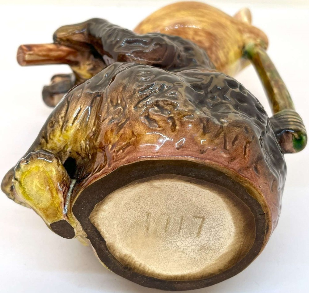 A Victorian earthenware majolica jug moulded in the form of a seated brown bear with an open snarling mouth and a pink-glazed interior. View V