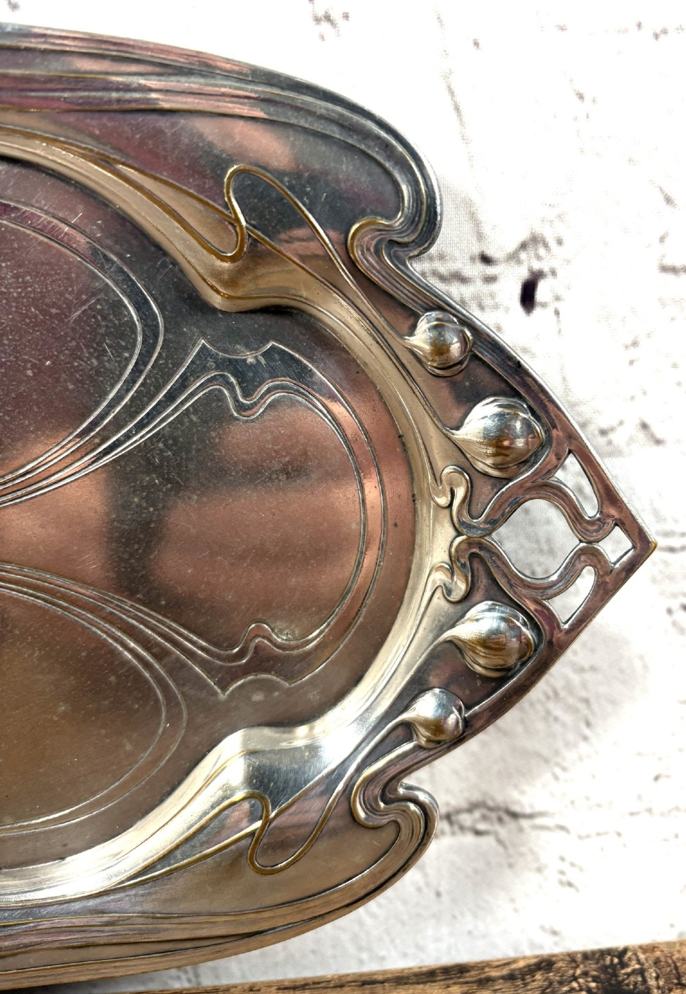 An antique rectangular silver-plated card tray featuring openwork Art Nouveau whiplash handles and engraved linear motifs in the centre. View III