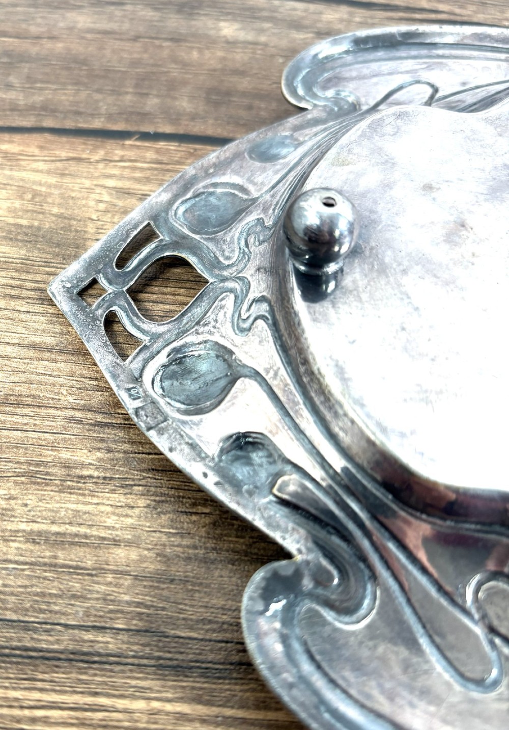 An antique rectangular silver-plated card tray featuring openwork Art Nouveau whiplash handles and engraved linear motifs in the centre. View VI