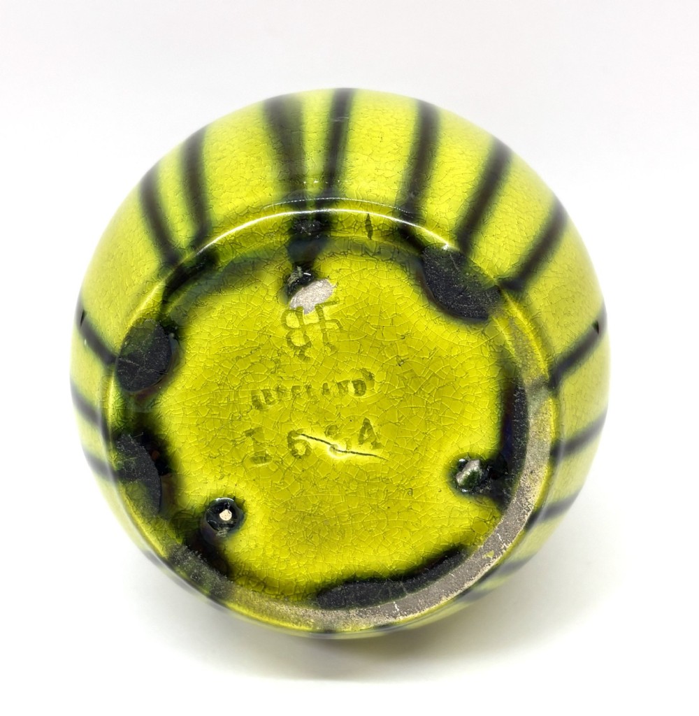 A ceramic vase with a long slender neck and bulbous body displaying vertical dark green drip glaze over a chartreuse background. View IV