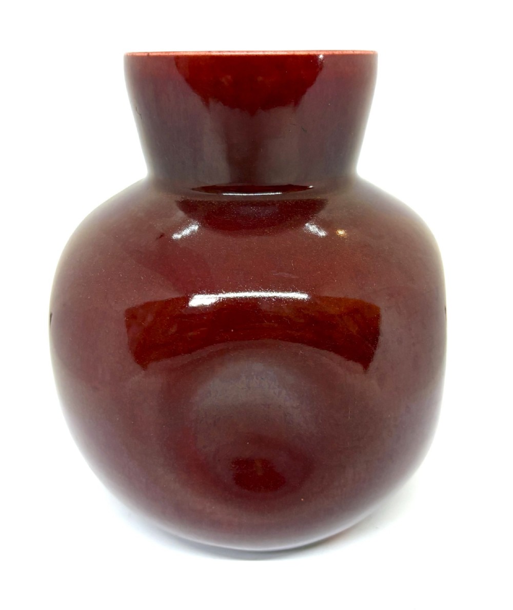 A bulbous ceramic vase with a glossy deep burgundy-brown glaze, indented dimples on the sides, and a short flared neck. View II